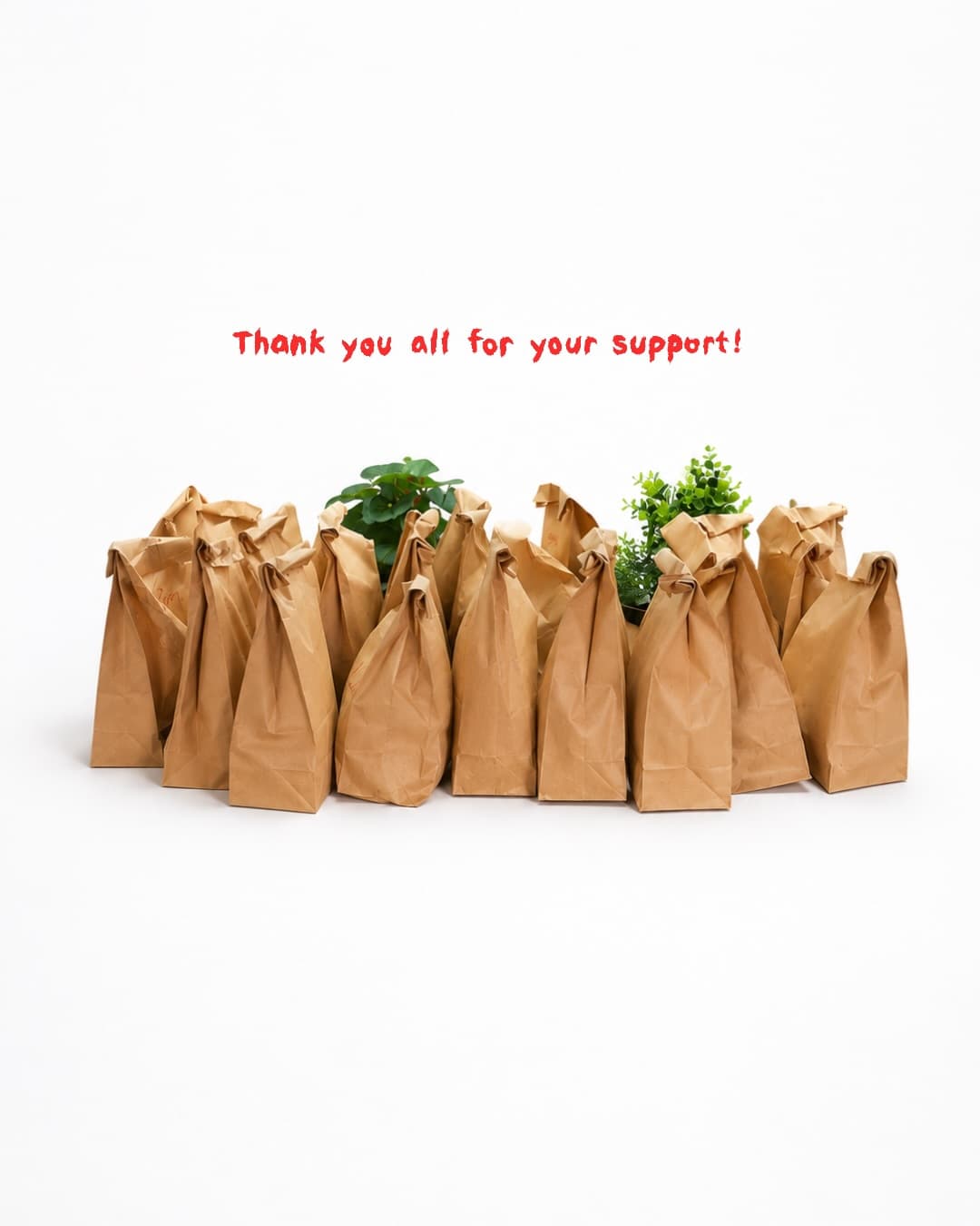 Packed brown meal bags with a handwritten thank-you note